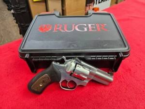Ruger GP100 Wiley Clapp 10mm revolver in front of factory hard case