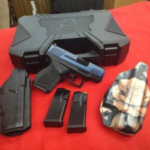 Pre-owned Taurus GX4 9mm pistol with 3 magazines and 2 holsters