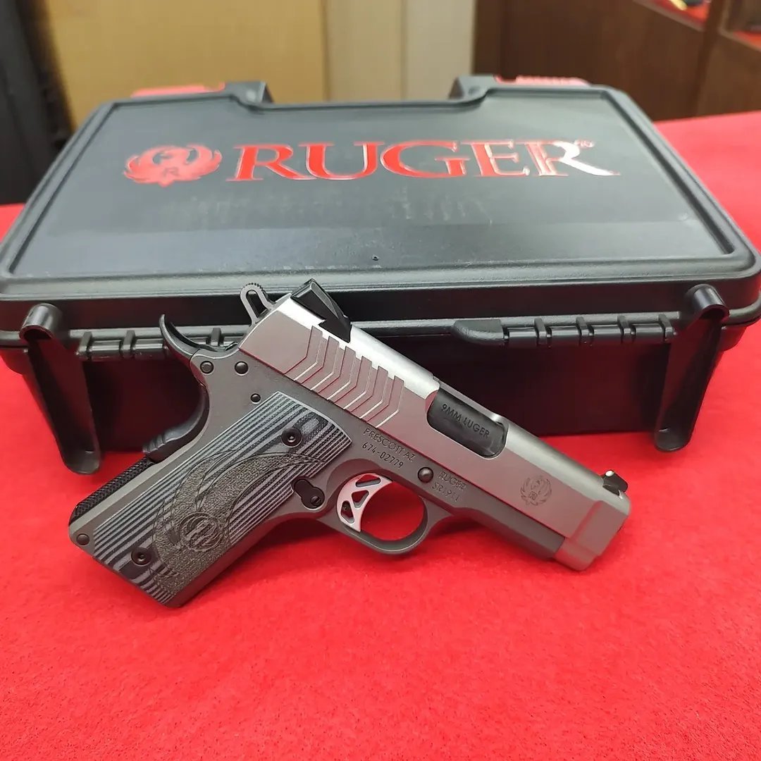 Ruger 1911 LW Officers 9mm pistol in front of factory hard case