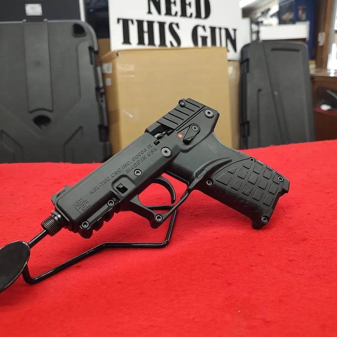 Pre-owned KelTec P17 22LR pistol with threaded barrel on display stand
