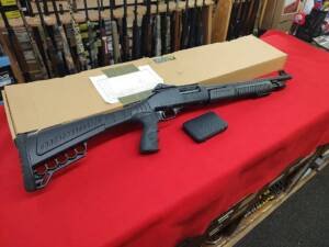 Used Radical 12 Gauge Shotgun with pistol grip stock, choke box, and factory box