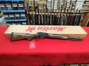 New Marlin 1895 Guide Gun 45-70 Gov lever action rifle with factory box on red background