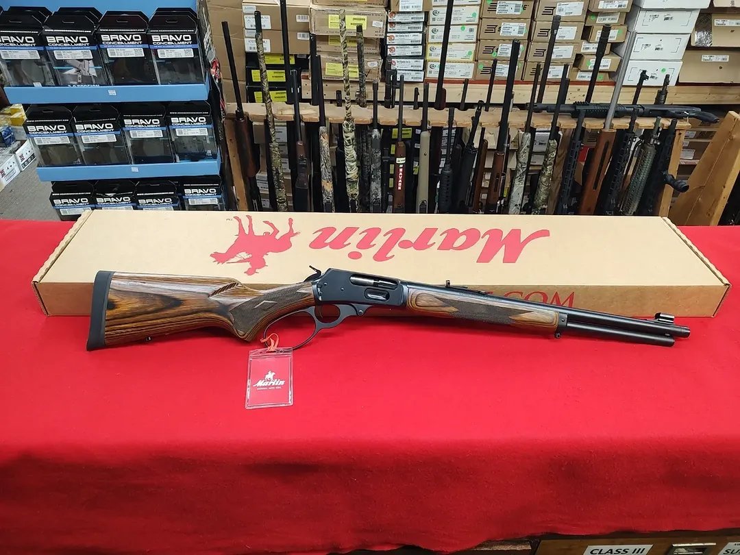 New Marlin 1895 Guide Gun 45-70 Gov lever action rifle with factory box on red background