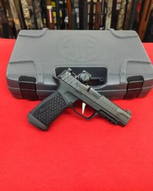 Sig P365 Fuse 9mm pistol with Romeo-X Red Dot in front of factory case