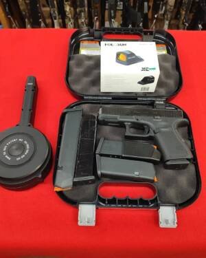 Pre-Owned Glock 19 Gen 5 pistol with Holosun green dot, 5 magazines, and drum mag in hard case