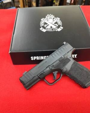 Springfield Armory Hellcat Pro Comp OSP 9mm handgun resting on factory box